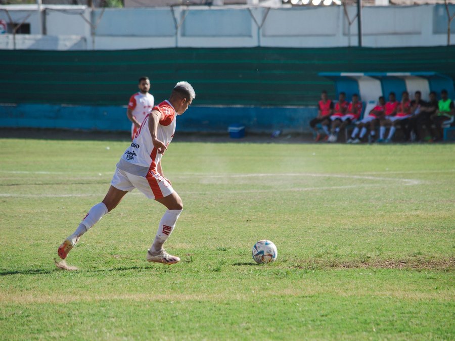 Soccer player driving the ball upfield